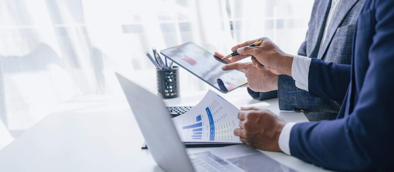 Business people reading reports and planning a new project
