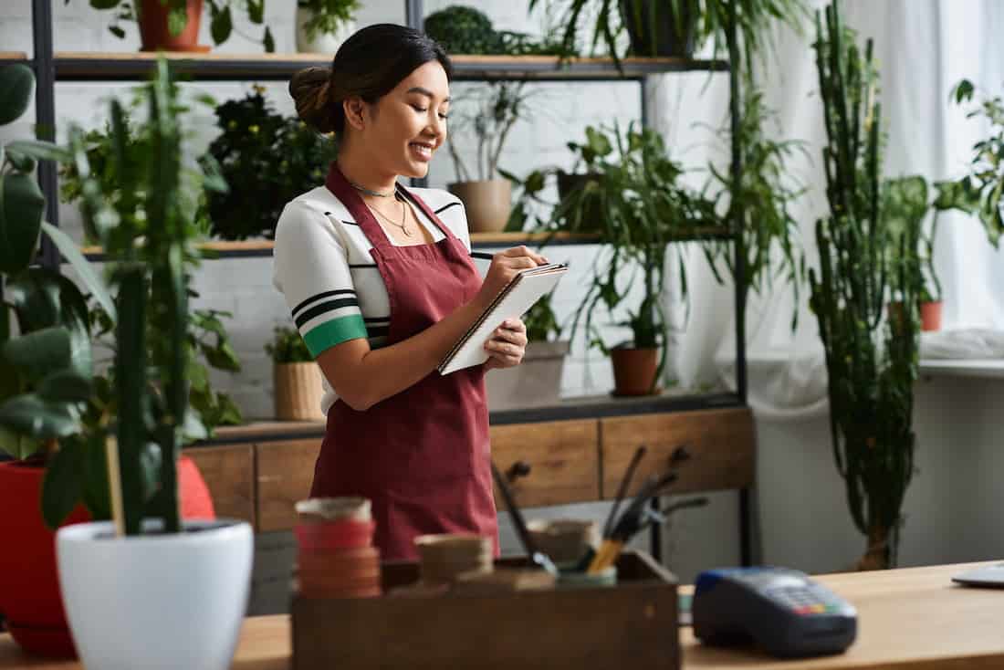 Happy business owner focusing on her business